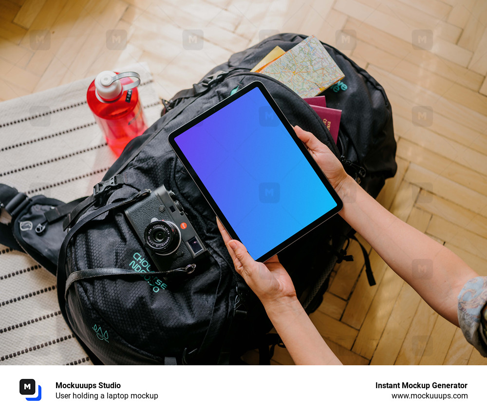 User holding a laptop mockup