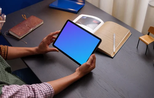 Female holding an iPad Air mockup