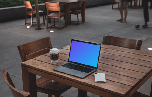 MacBook Pro mockup on wooden desk