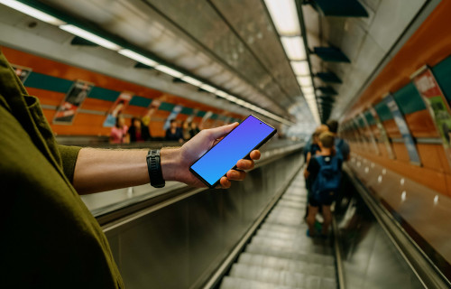 Person holding a smartphone mockup