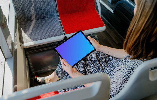 Person reading on an iPad Air mockup