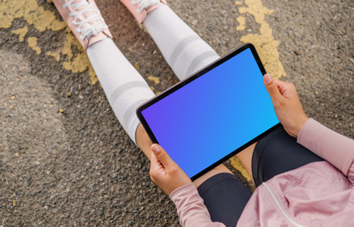 Woman reading on an iPad mockup
