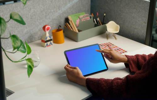Woman working on an iPad Air mockup