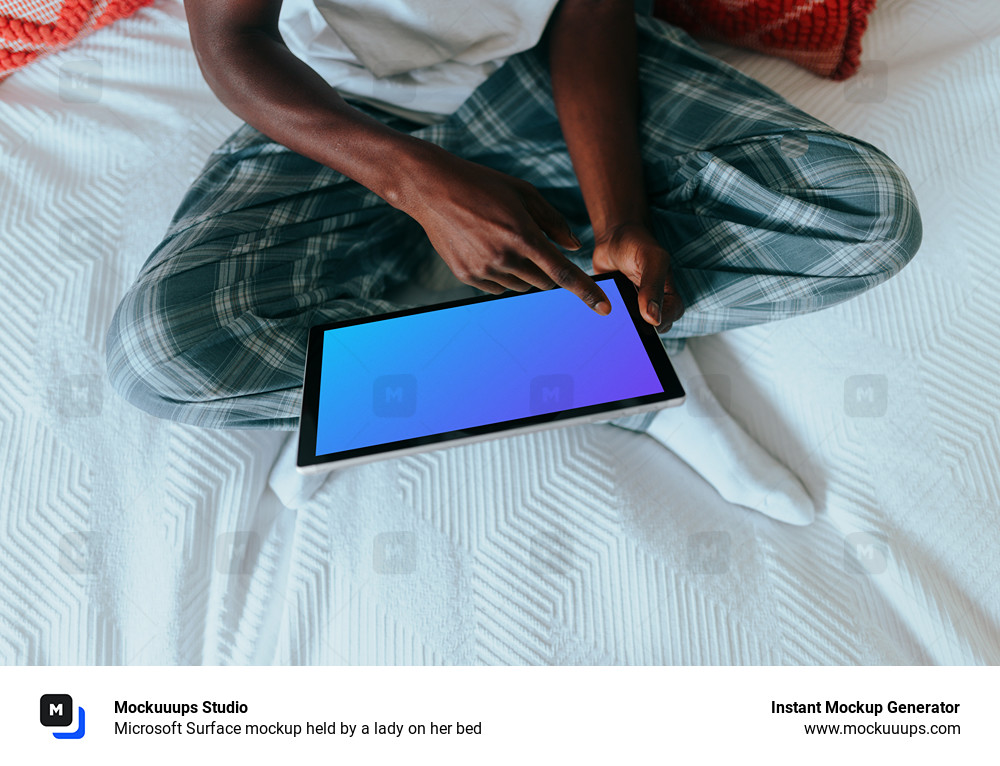Microsoft Surface mockup held by a lady on her bed