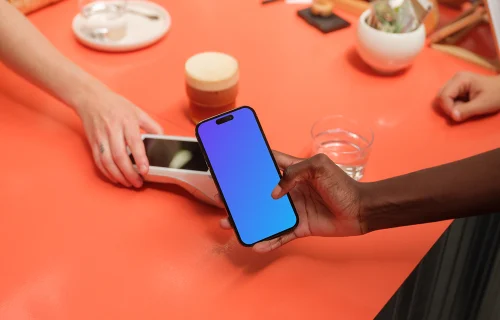 Female entrepreneur holding a iPhone mockup