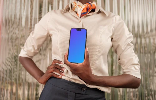 Female entrepreneur holding an iPhone mockup