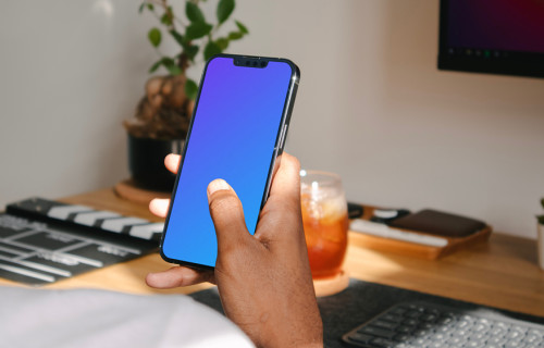 Hand holding a smartphone mockup
