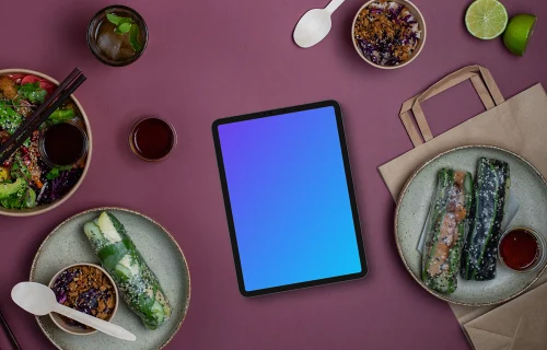 Tablet mockup surrounded by Asian food