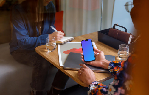 Woman holding an iPhone 14 Pro mockup