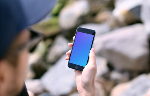 Holding iPhone 6s mockup during sunny day
