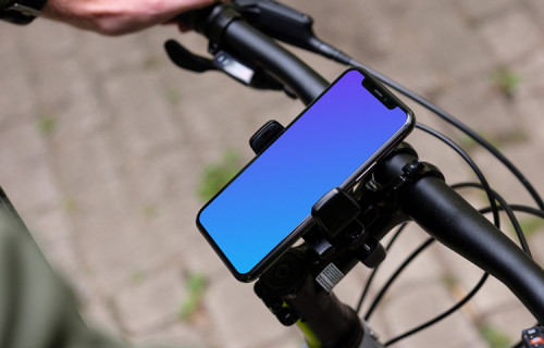 Side view of riding a bike with iPhone 11 Pro mockup in bike mount