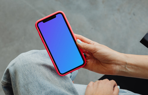 iPhone mockup held in a users hand