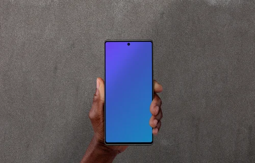 Holding smartphone mockup against the wall background